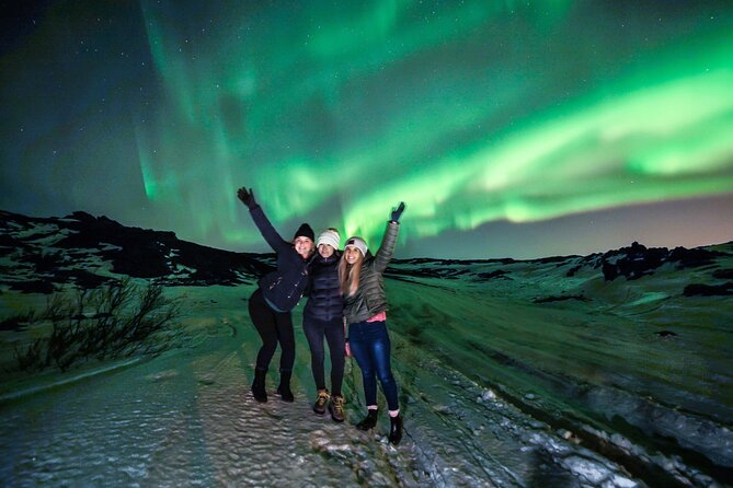 Northern Lights illuminating the night sky above an Icelandic landscape