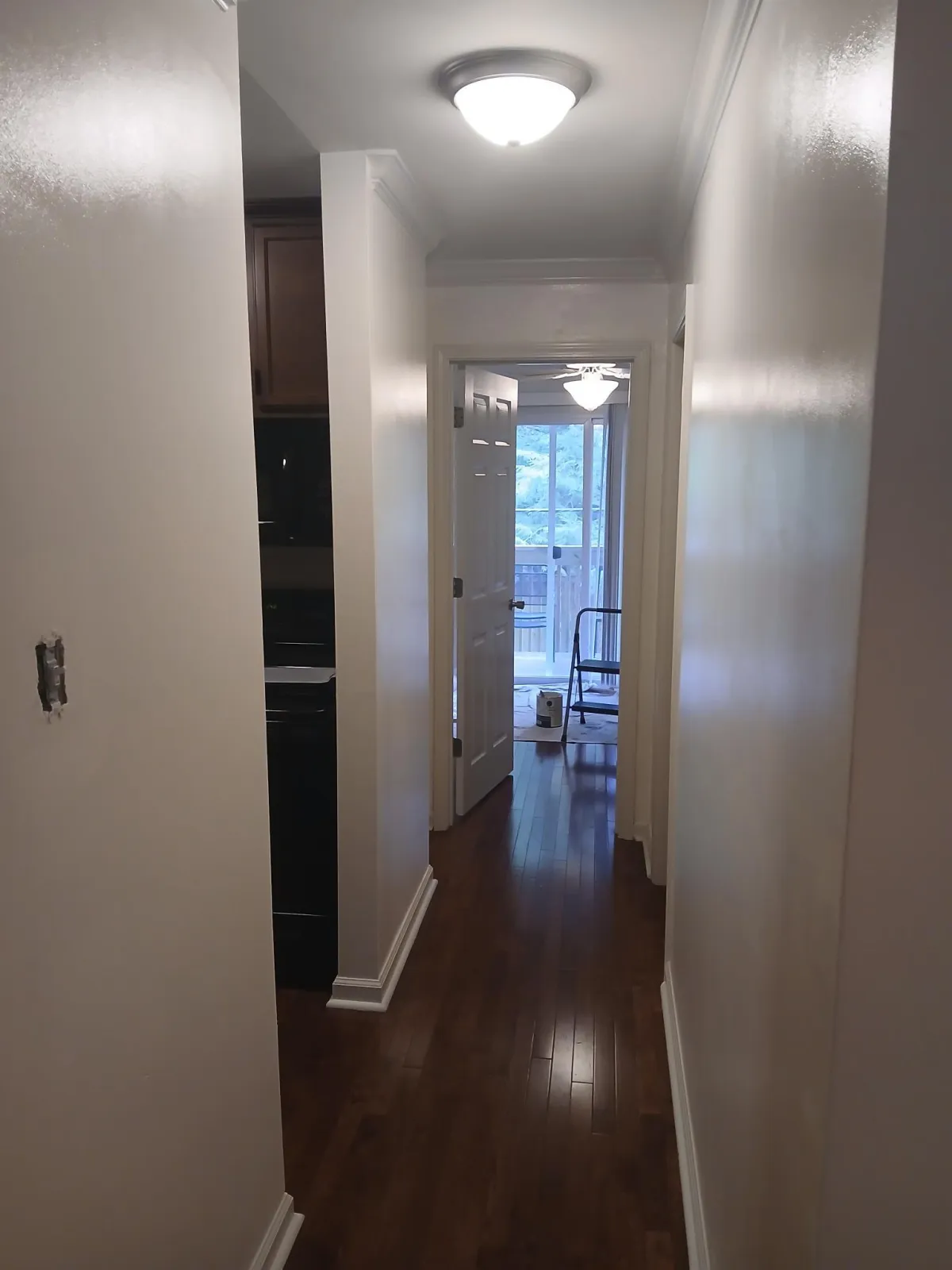 Bright hallway painting with crisp walls and trim that make the space feel open and inviting
