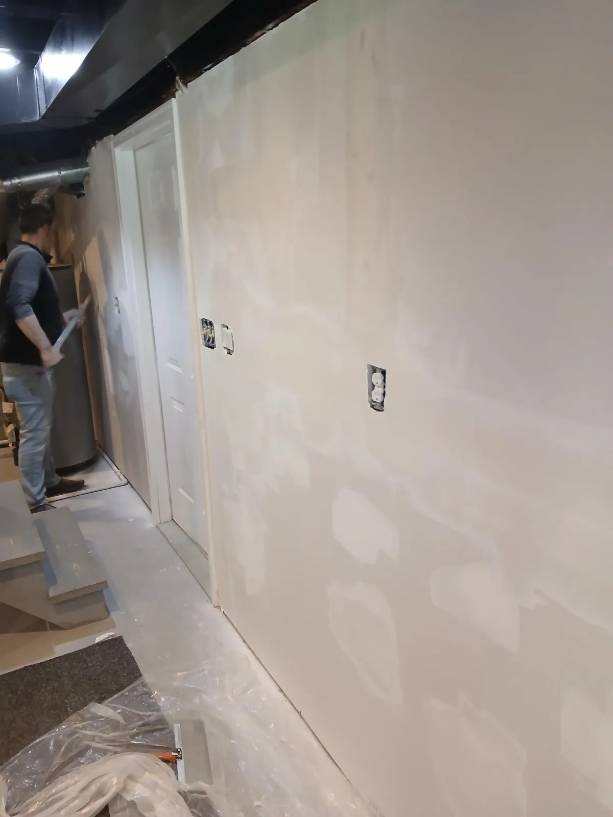 Drywall patching and preparation for a smooth surface ready for paint