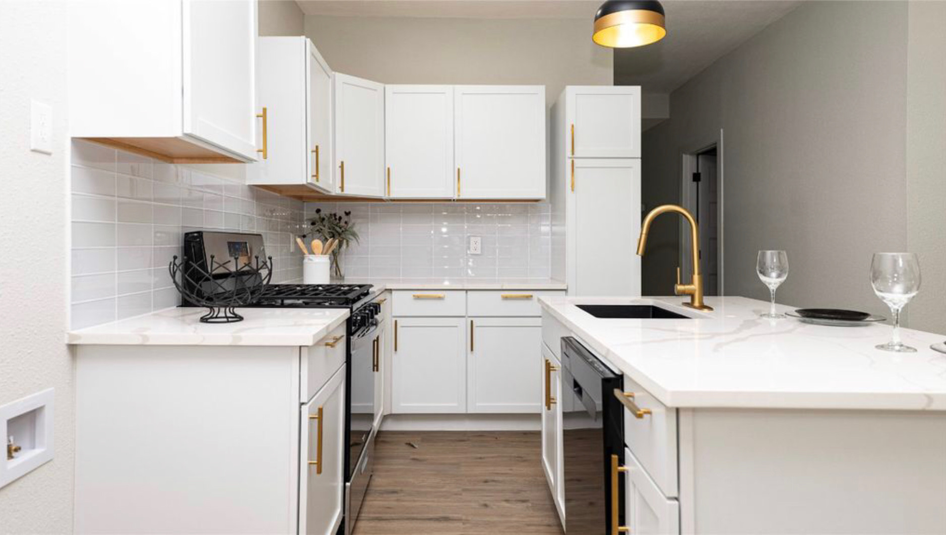 turned on pendant lamps above kitchen island