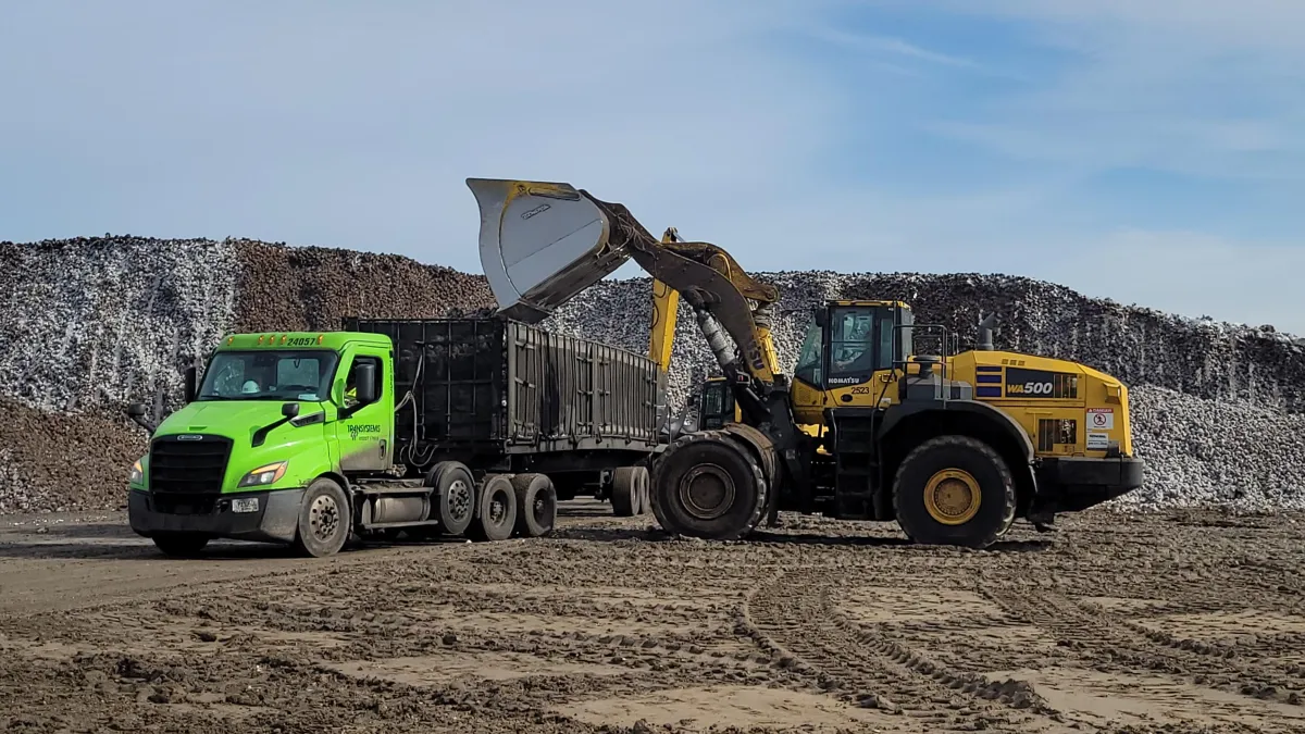 Semi Truck with cage trailer and kamatsu front end loader