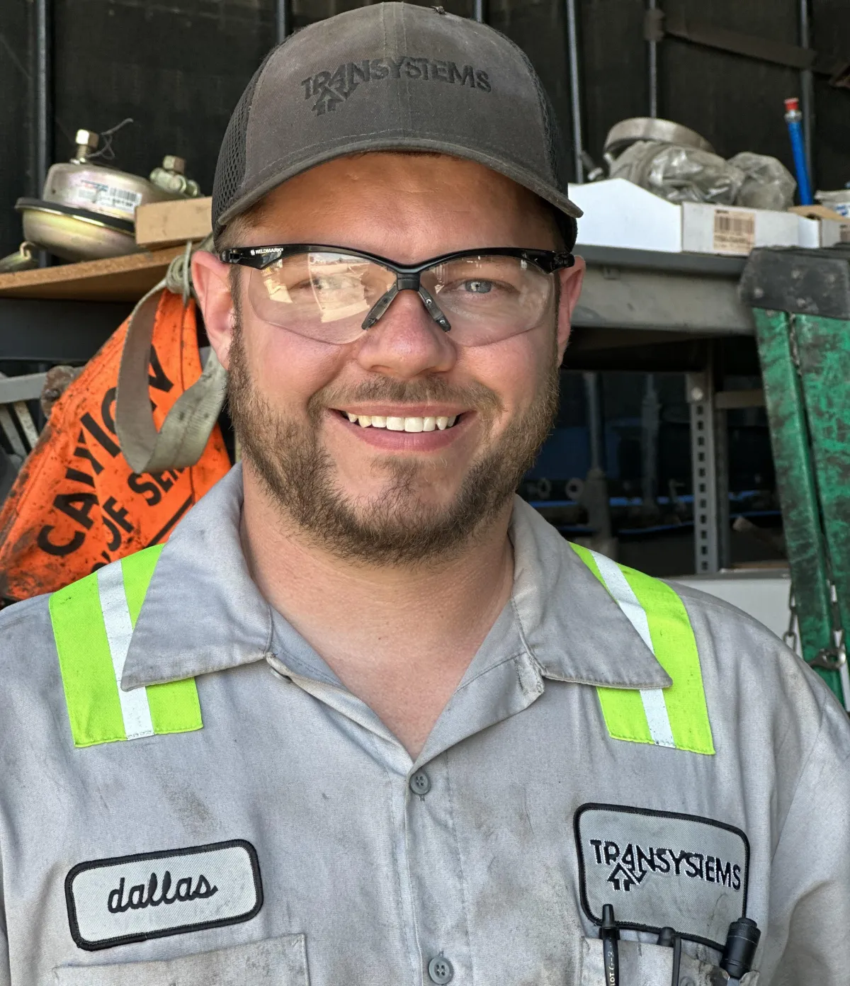 a boat traveling down a river next to a forest