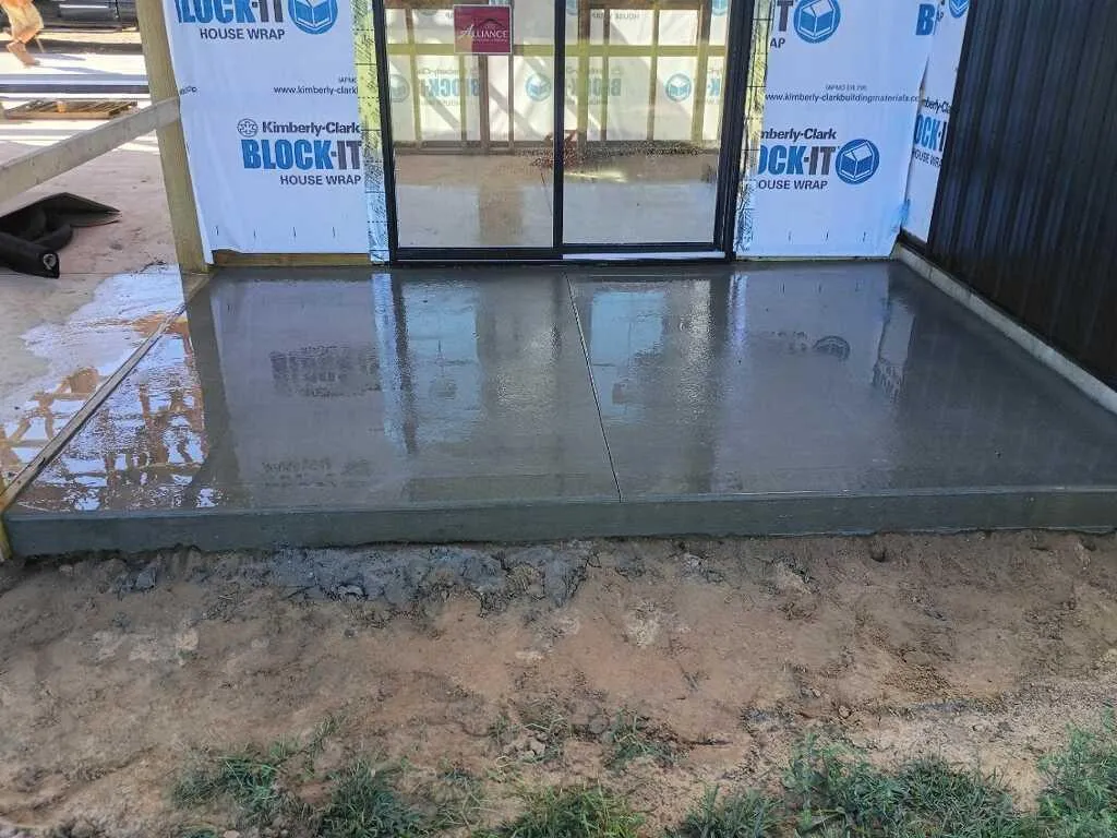Freshly poured concrete floor at a pole barn construction project in Douglas, MI.
