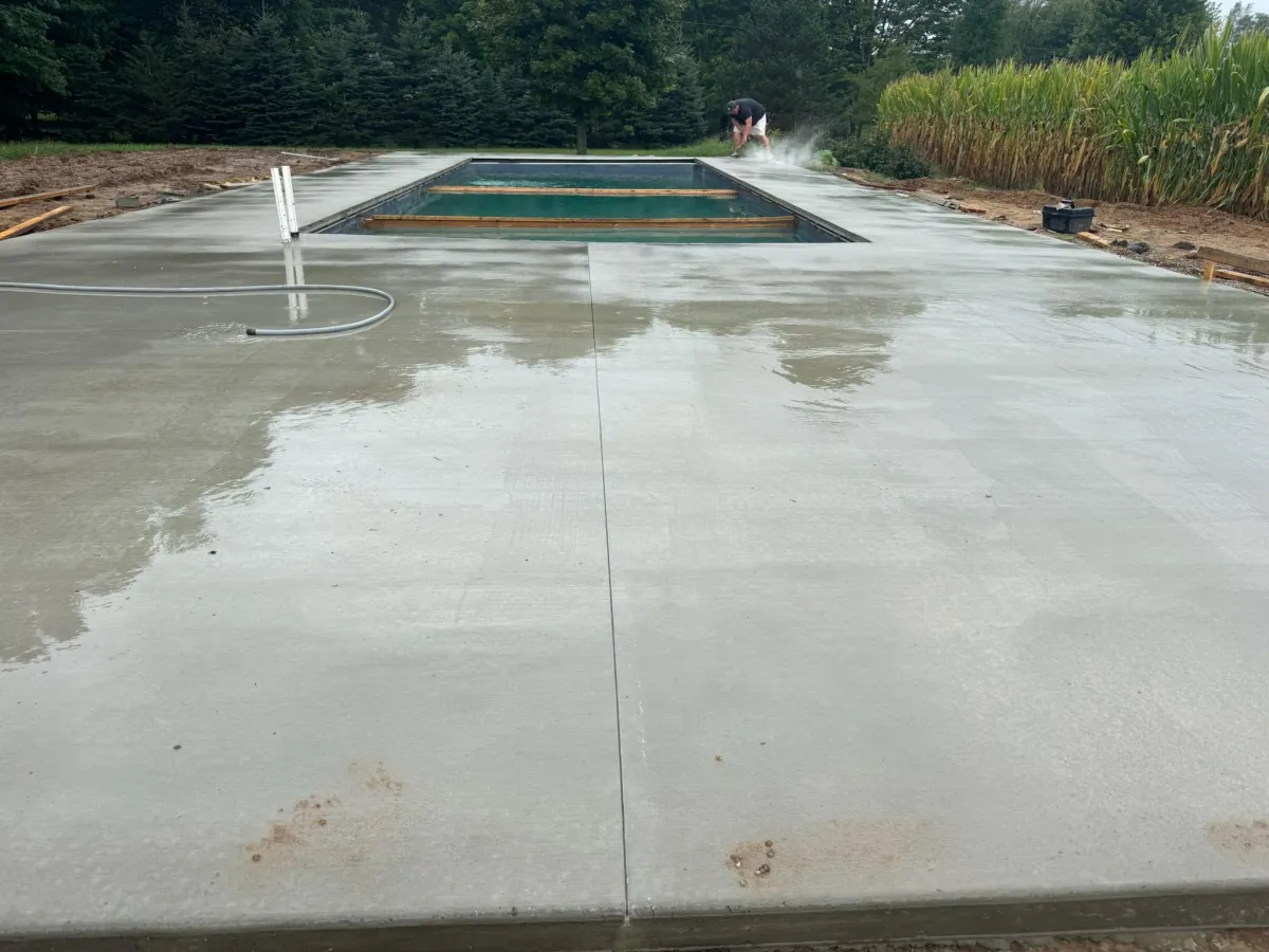 Freshly finished concrete patio and pool deck installation in Zeeland, MI.