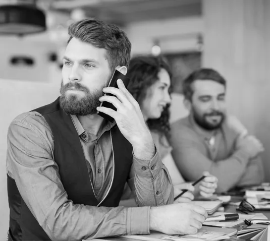 Business professional talking on the phone in an office setting