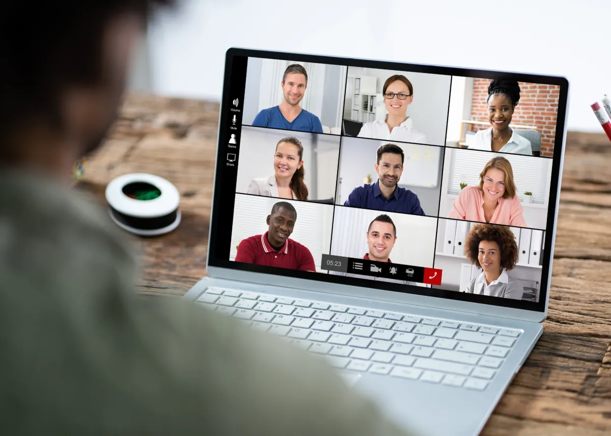 Two businesswomen talking outside modern office building.