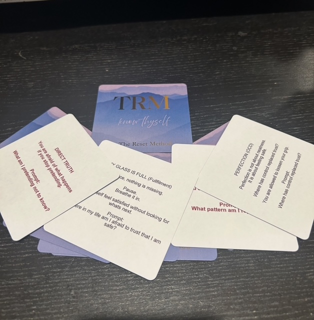 Artful deck of Reset Cards arranged on a soft surface
