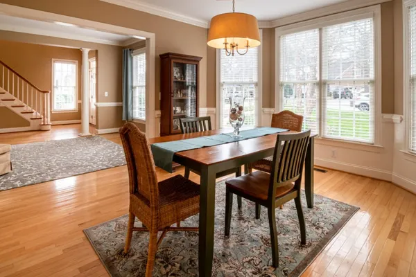Dining and living area representing a home going through a short sale