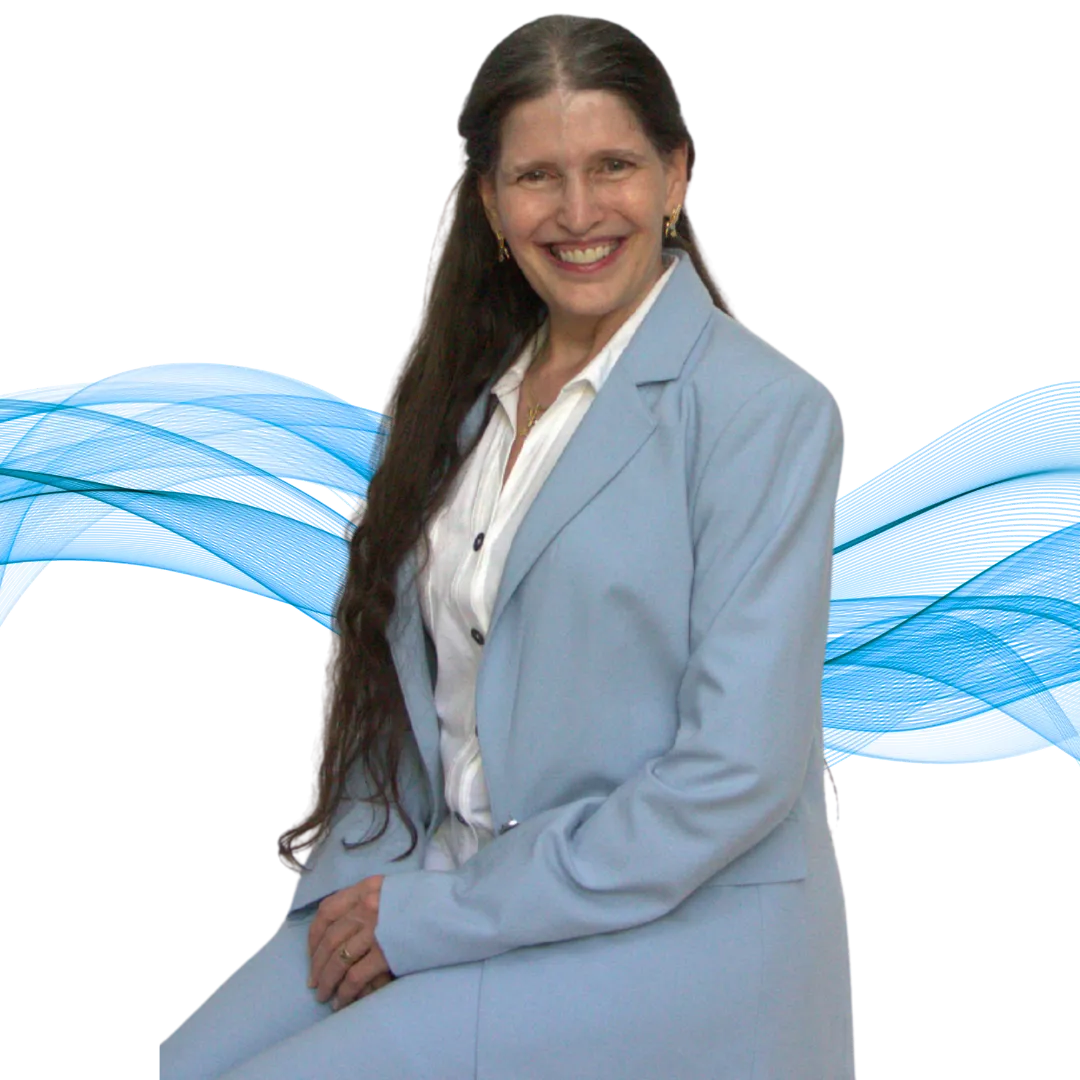 A professional portrait of Victoria, smiling warmly. She is wearing a light blue blazer over a white blouse, seated confidently against a dark background with soft blue wave accents, creating a calm, polished, and empowering feel.