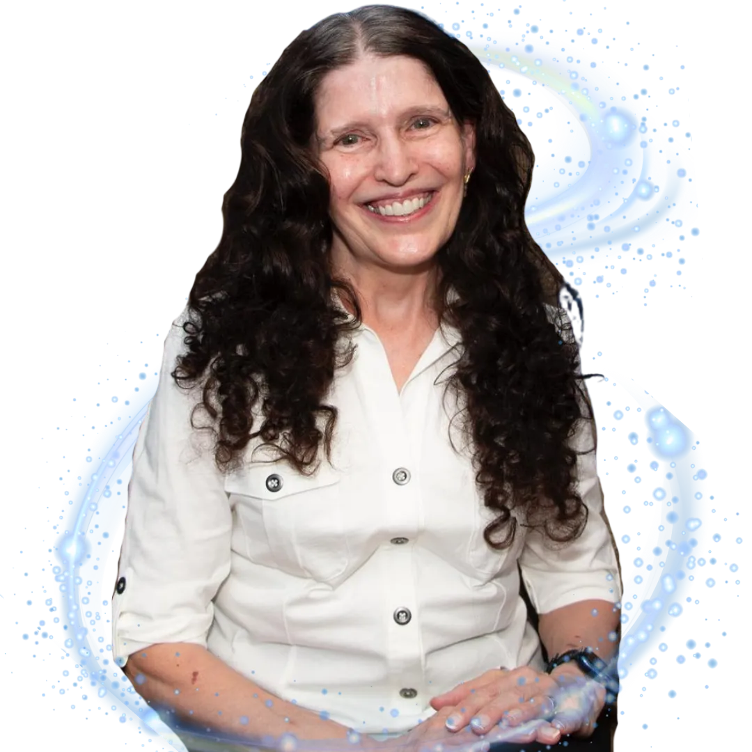 Victoria Essner, a legally blind assistive technology coach and caregiver advocate, is seated and smiling warmly in a white buttoned shirt. She has long, curly dark hair and a gentle, encouraging presence. A soft blue swirl design surrounds her, symbolizing support, calm, and empowerment. The image conveys compassion, wisdom, and strength, reflecting Victoria’s mission to uplift caregivers and blind or visually impaired individuals through practical guidance and heartfelt encouragement.