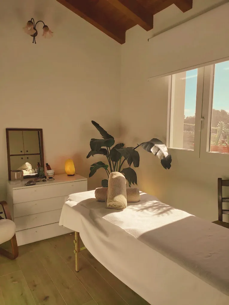 Sunlit tranquil treatment room overlooking the Mediterranean coast in Marina Di Ragusa