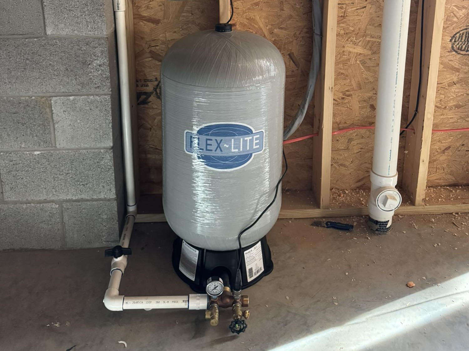 Roofing contractor inspecting a residential roof