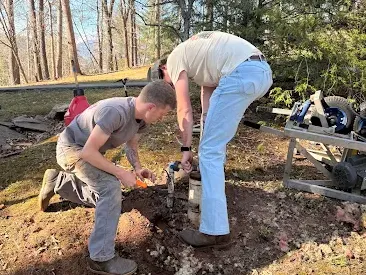 Roof repair technician fixing damaged shingles
