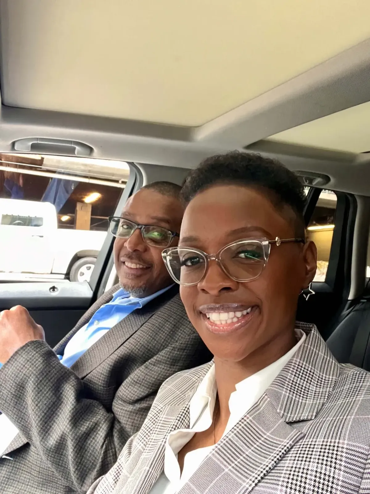Bobby and Falecia Terry, associate brokers with eXp Realty and founders of Georgia Probate Realty, smiling in business attire.
