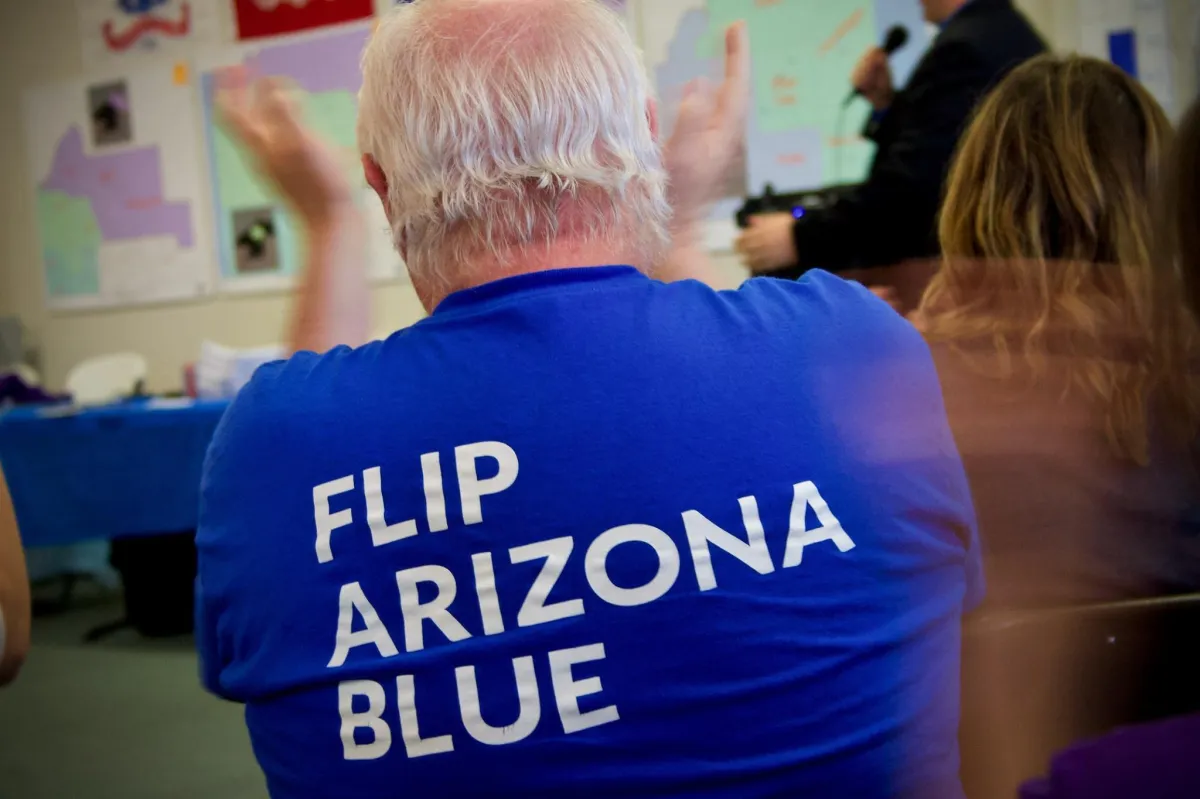 Back of person wearing a shirt saying Flip Arizona Blue
