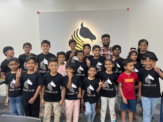 Students at CHESS KLUB with jersey on a Stage