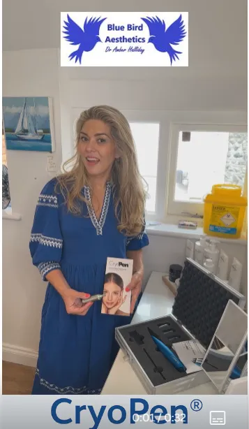 Dr Amber Halliday holding a CryoPen for Cryotherapy in the tranquil clinic room.
