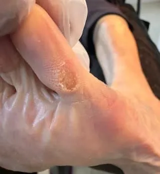 person holding brush and foot