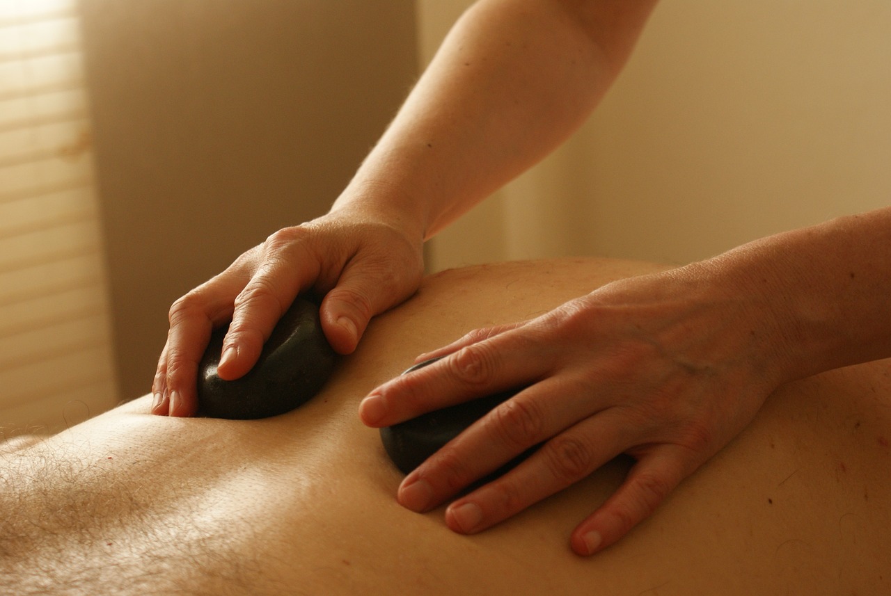 hot stone therapy applied to massage client