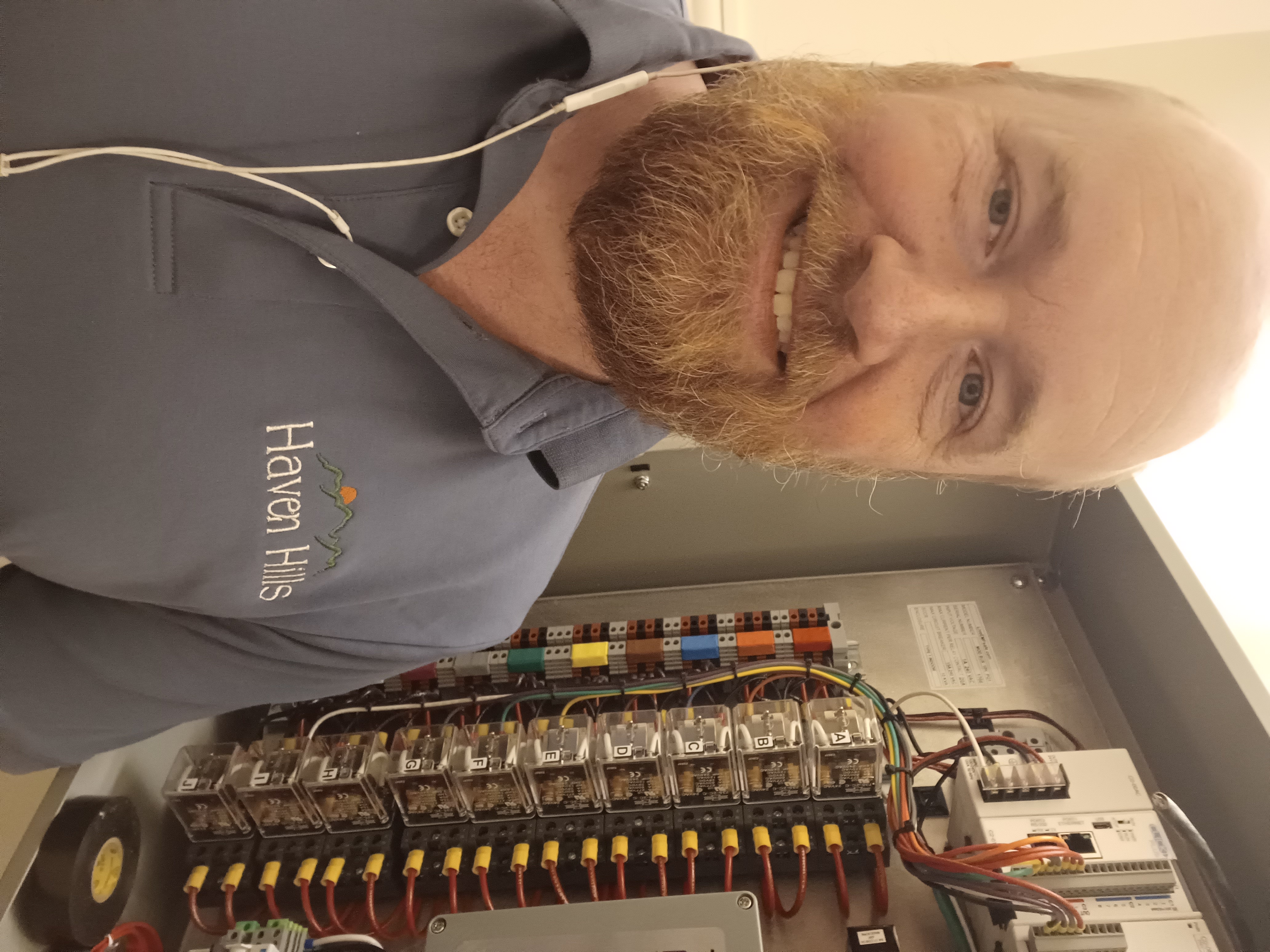 Photo of Haven Hills Founder Chris Hoffmeyer with complex EMF Sleep Switch in background.