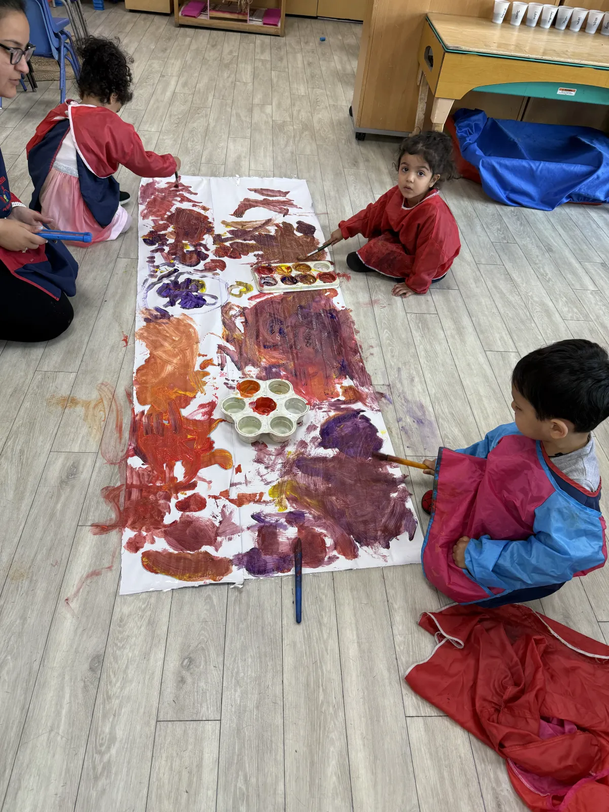 Toddlers during Messy play encouraging expression
