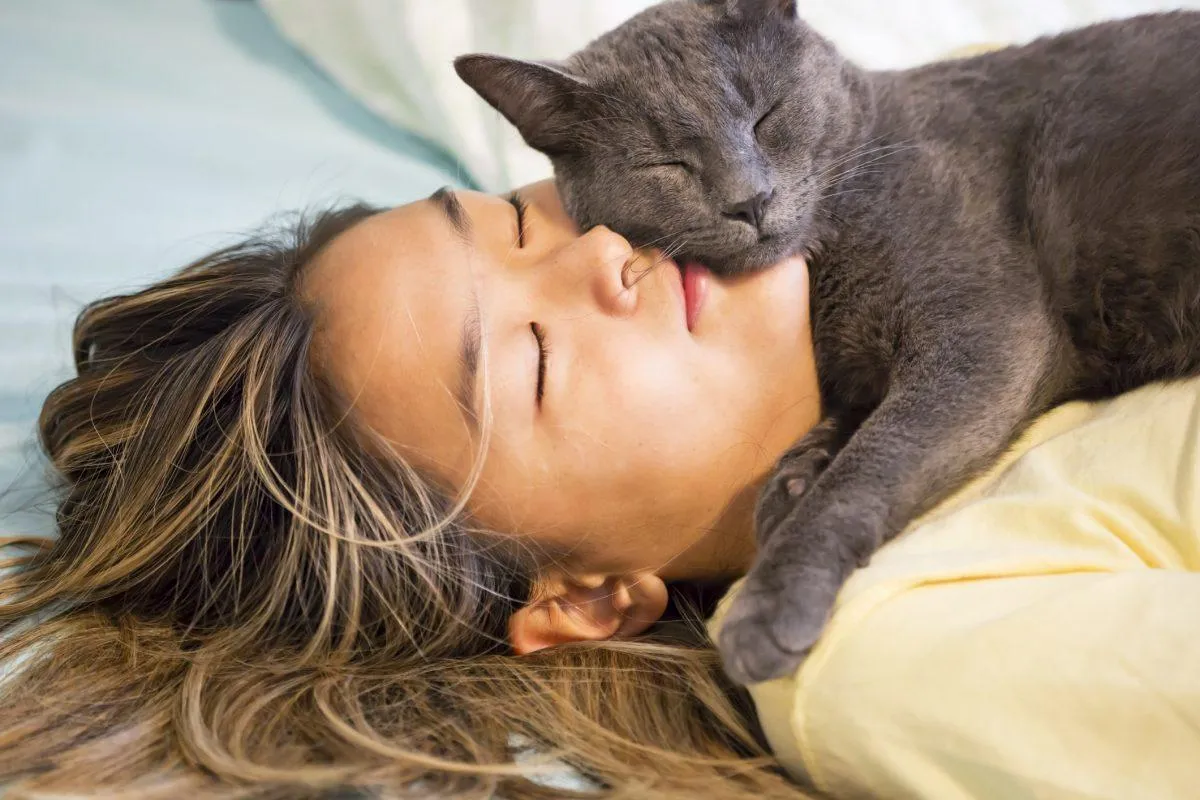 Lady cuddling a cat
