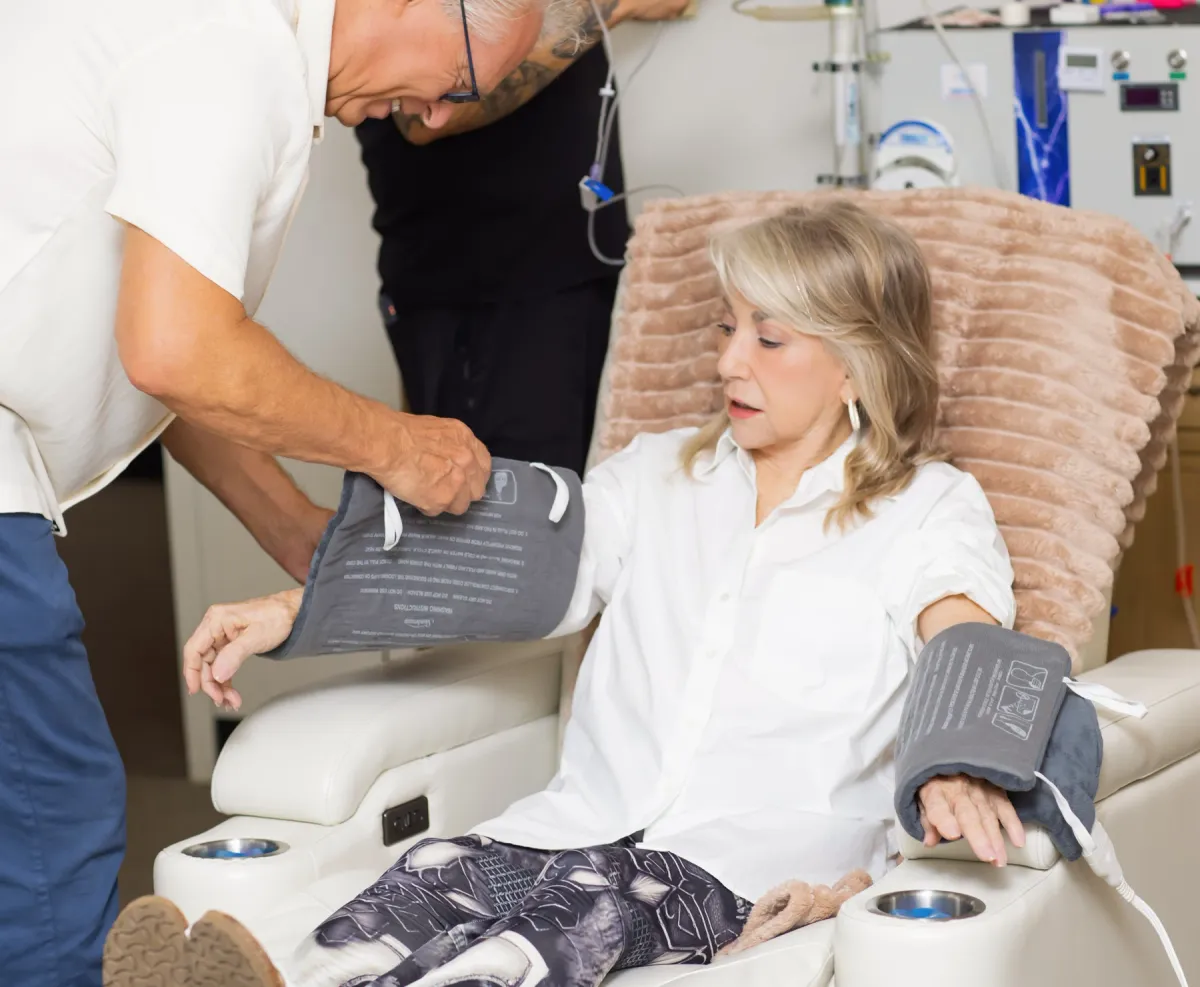 A blood pressure cuff in use during a calm clinical care interaction