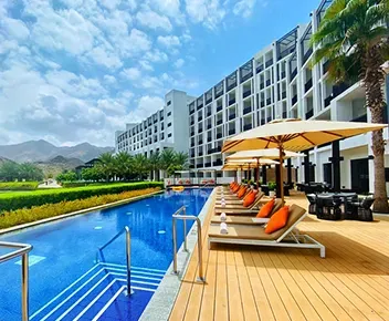 a view of a mountain range from a car's side view mirror