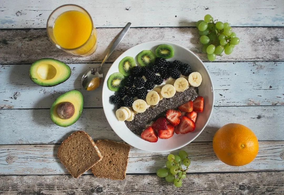 Healthy Fruit and Yogurt in a Bowl on a Wooden Table