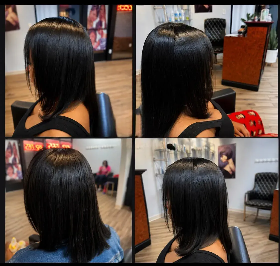 Stylist performing signature Dominican blowout on textured hair in modern luxury salon