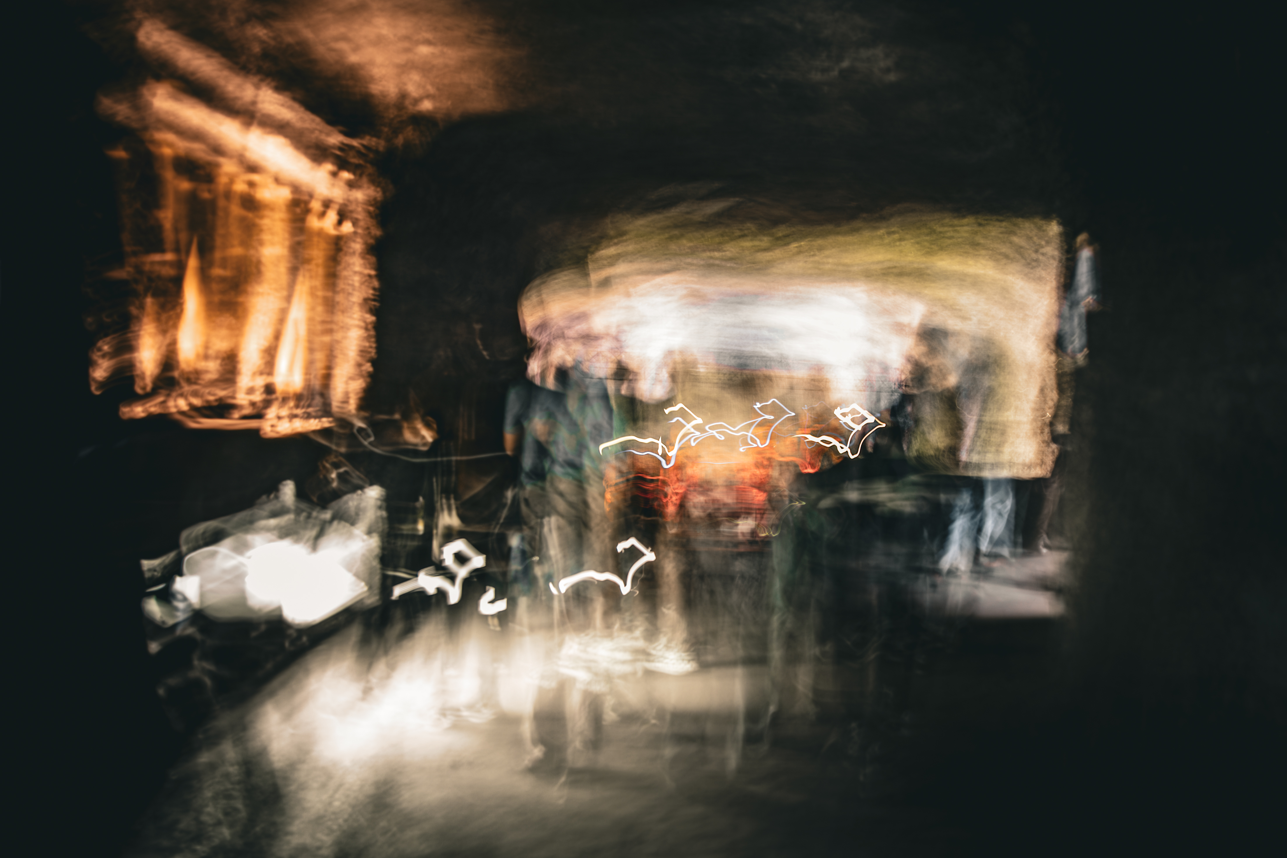 Long exposure ICM abstract photograph of figures and light in motion inside the Salt Cathedral of Zipaquirá, Colombia, by fine art photographer Angie Harker