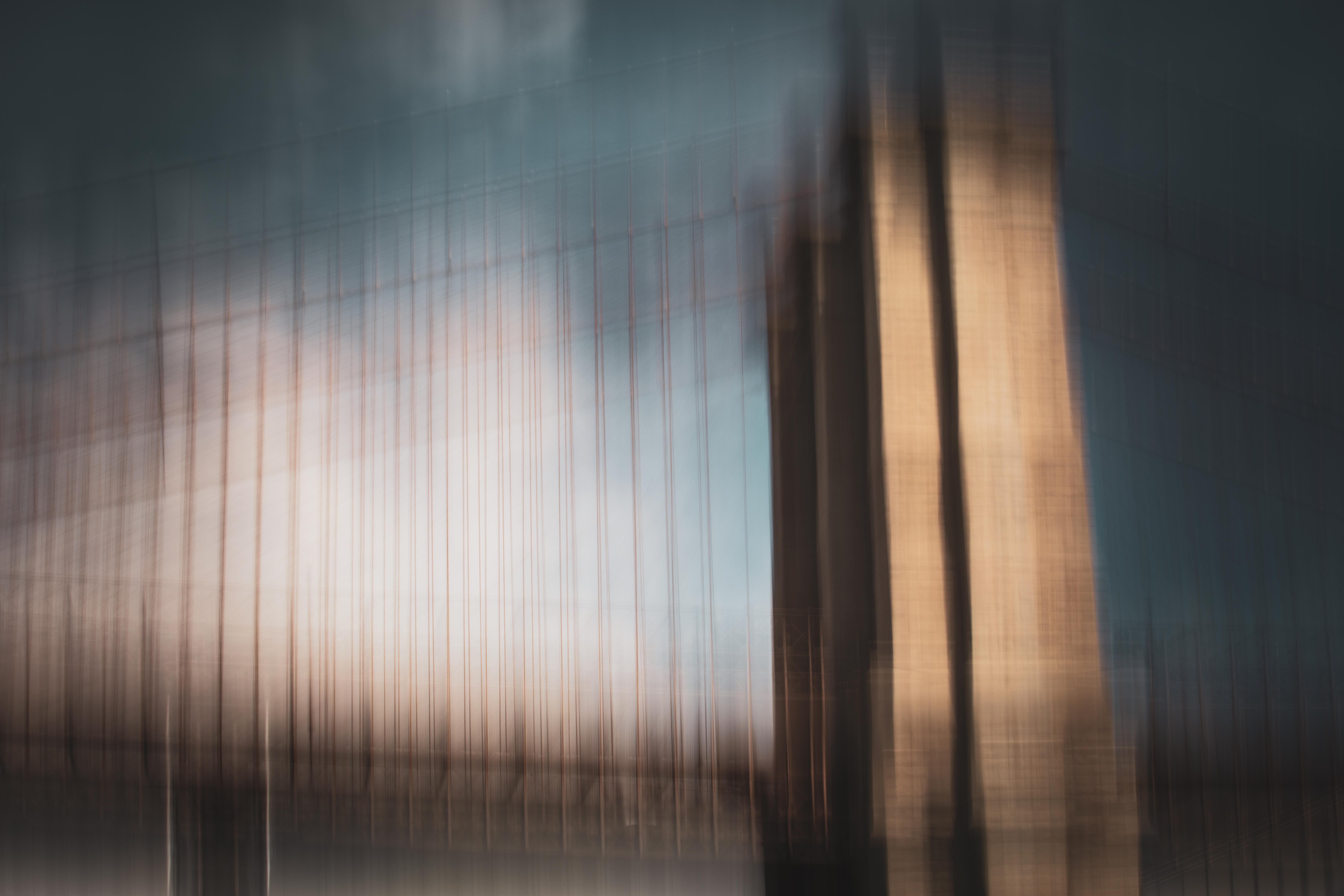 Manhattan Bridge cables fading into fog-like softness, an ICM long exposure fine art photograph by Angie Harker