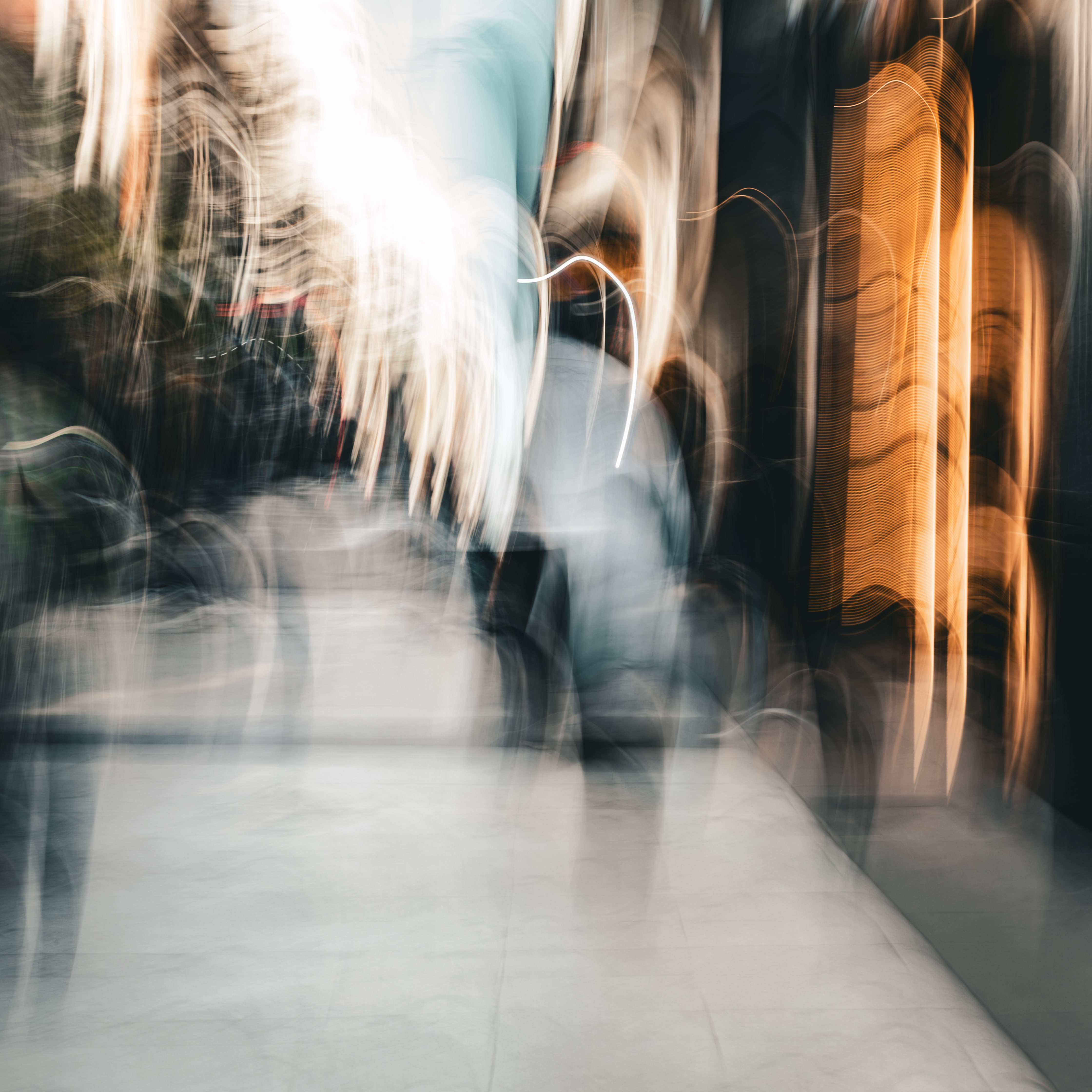 Long exposure ICM photograph of figures overlapping and flickering on a Buenos Aires street at dusk, multiple positions in time occupying the same frame, by fine art photographer Angie Harker