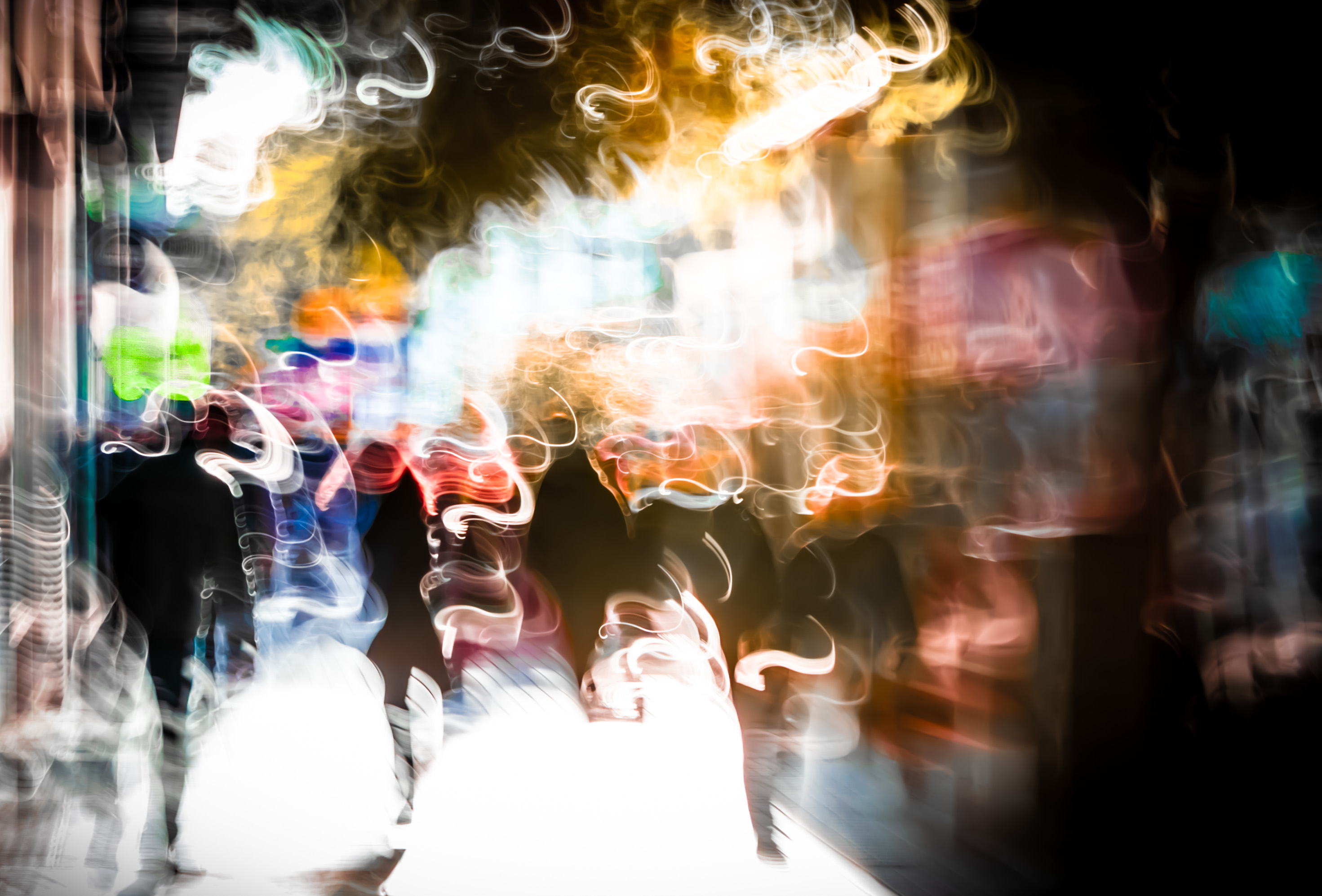 Long exposure ICM photograph of figures layered in golden light at winter dusk in Buenos Aires, shadows stretching long across cobblestones, by fine art photographer Angie Harker