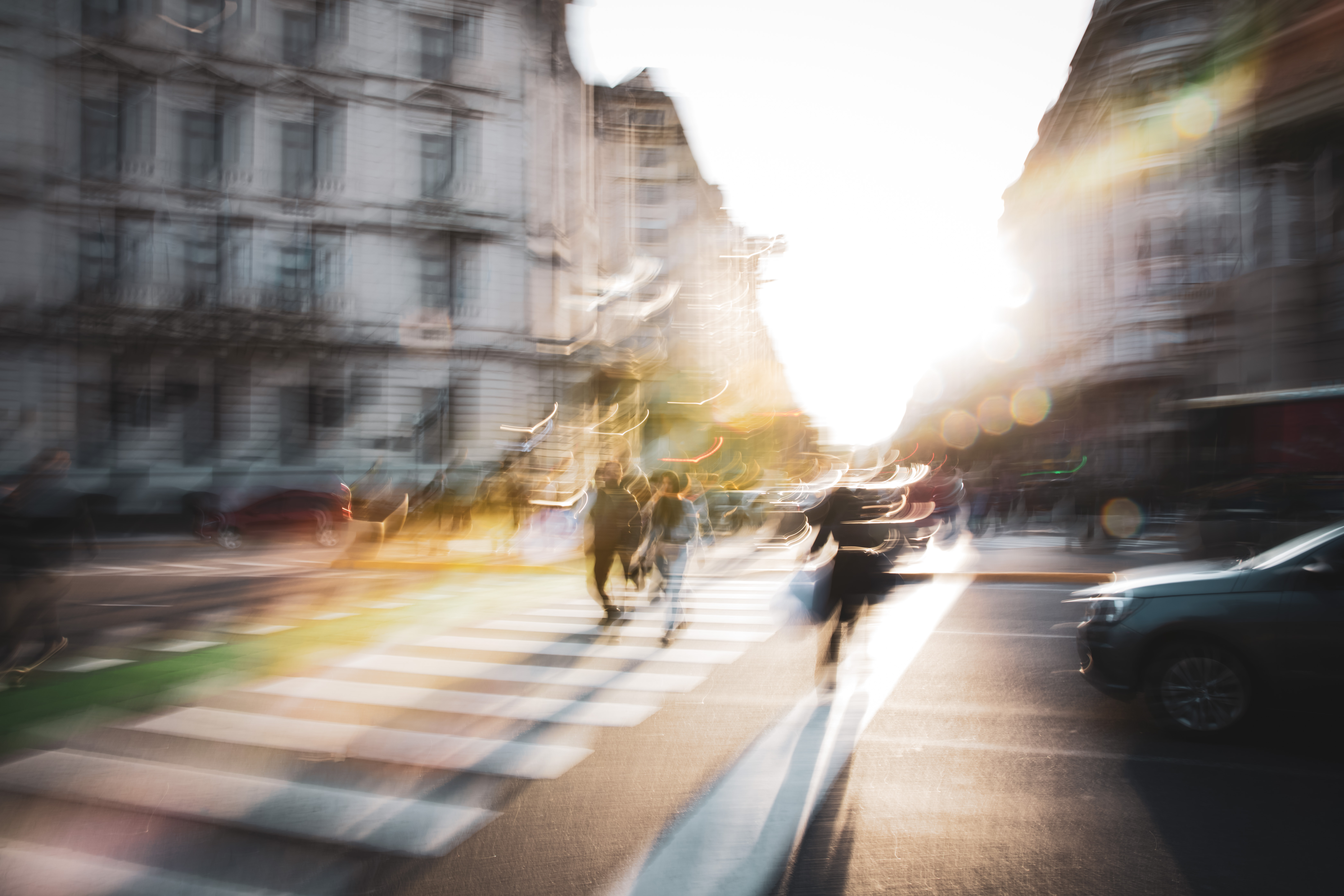Long exposure ICM photograph of a figure racing the countdown at a Buenos Aires crosswalk at winter dusk, light fracturing into the street, by fine art photographer Angie Harker