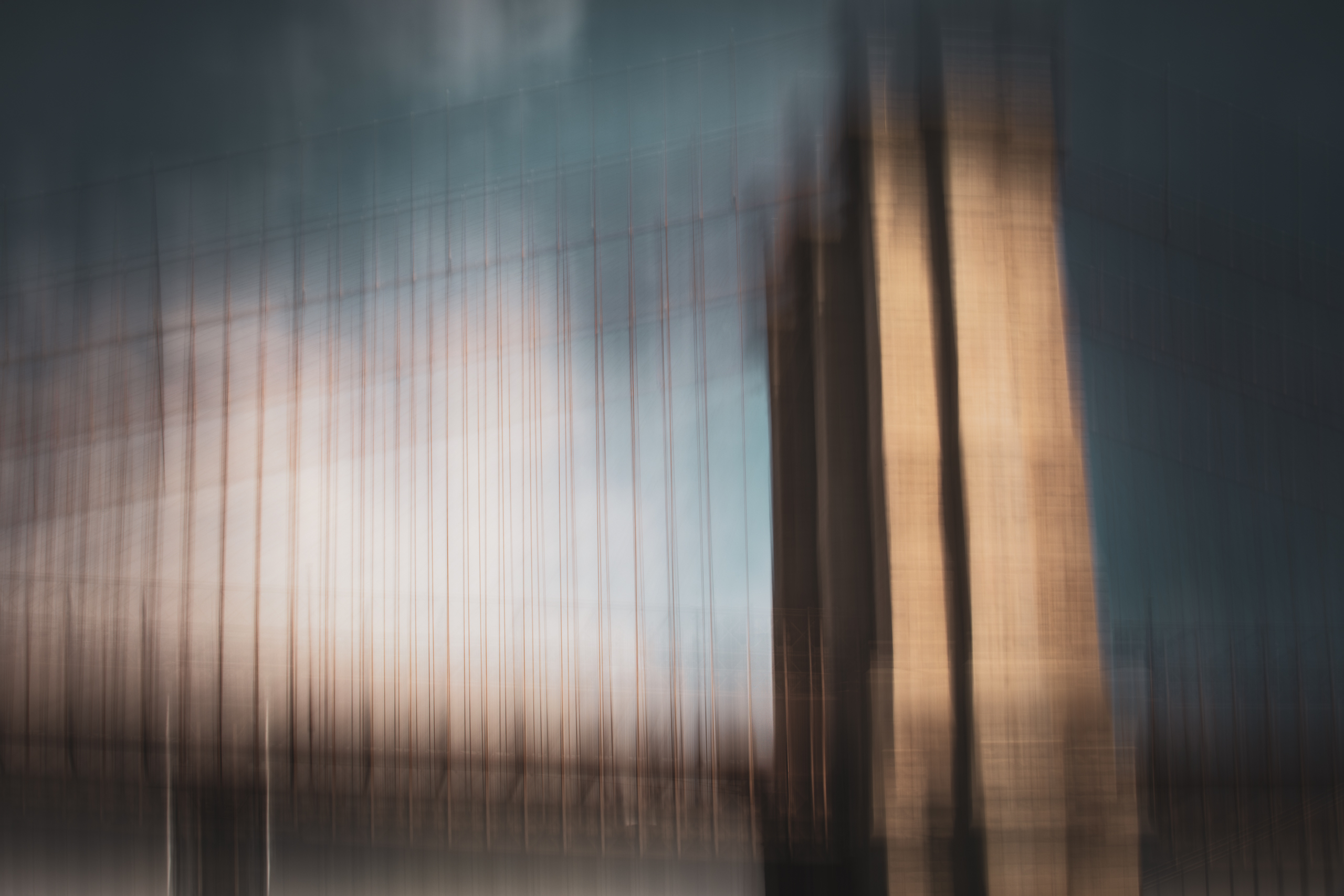 Manhattan Bridge cables fading into fog-like softness, an ICM long exposure fine art photograph by Angie Harker