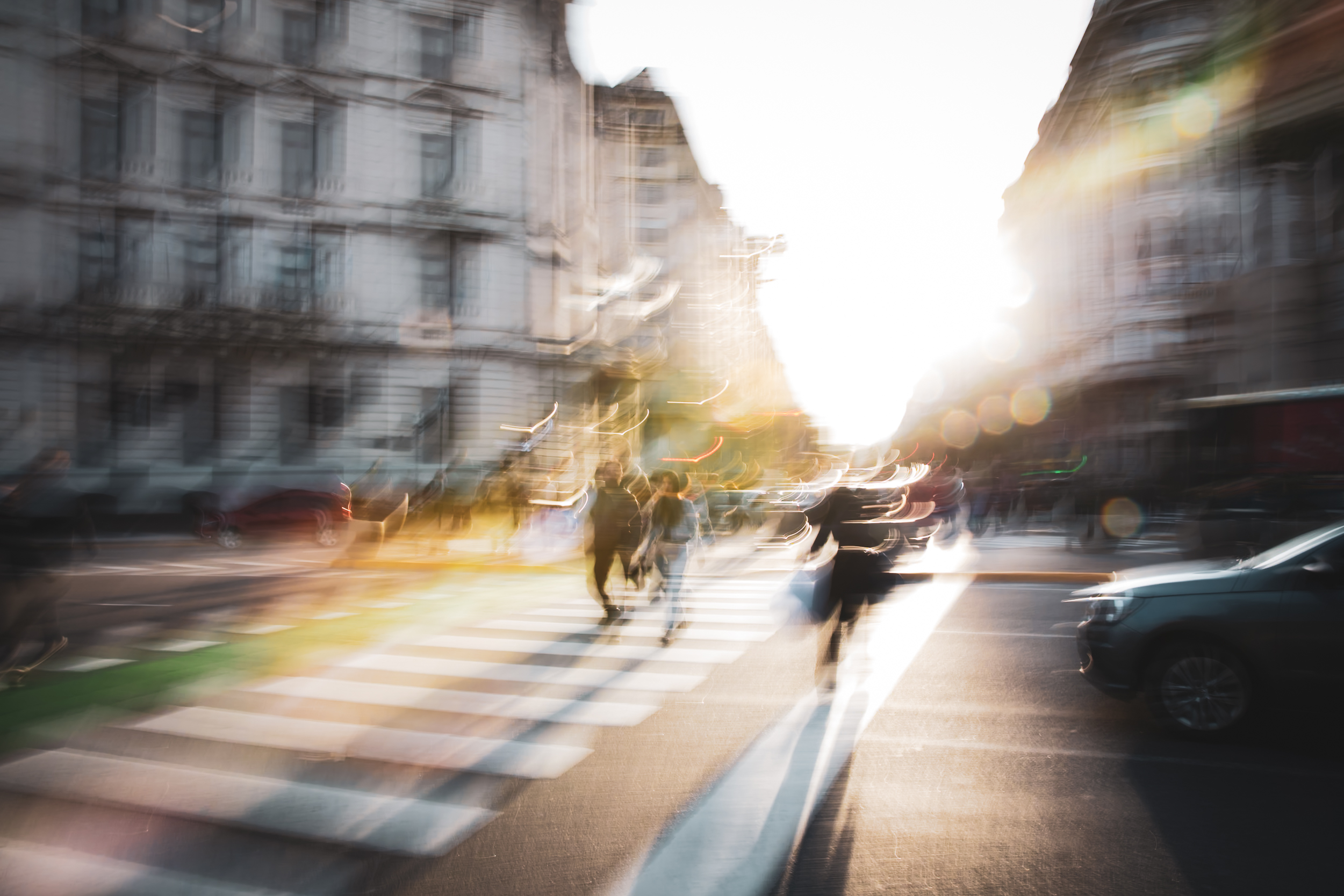 Long exposure ICM photograph of a figure racing the countdown at a Buenos Aires crosswalk at winter dusk, light fracturing into the street, by fine art photographer Angie Harker