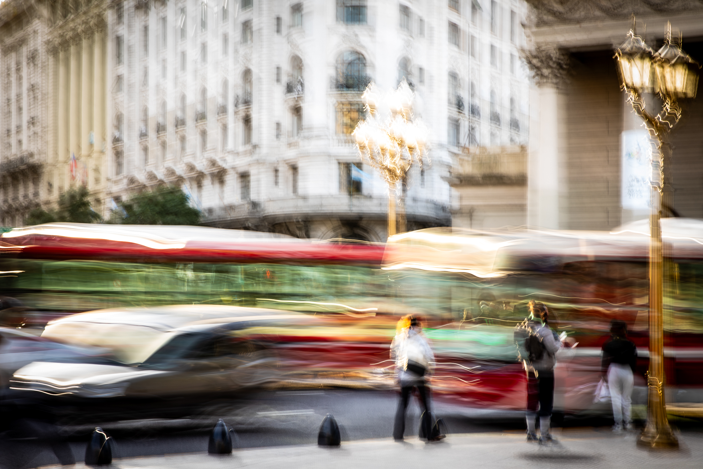 Long exposure ICM photograph of a figure racing the countdown at a Buenos Aires crosswalk at winter dusk, light fracturing into the street, by fine art photographer Angie Harker
