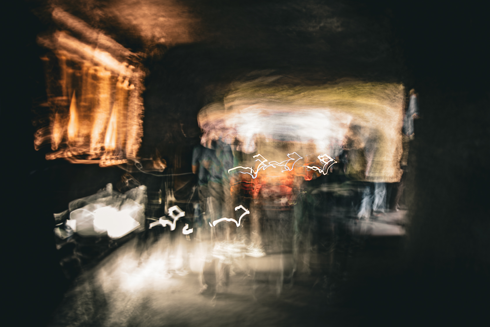 Long exposure ICM abstract photograph of figures and light in motion inside the Salt Cathedral of Zipaquirá, Colombia, by fine art photographer Angie Harker