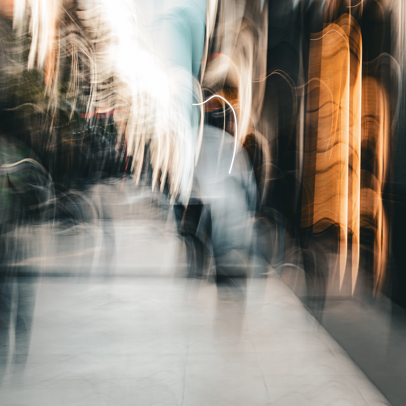 Long exposure ICM photograph of figures overlapping and flickering on a Buenos Aires street at dusk, multiple positions in time occupying the same frame, by fine art photographer Angie Harker