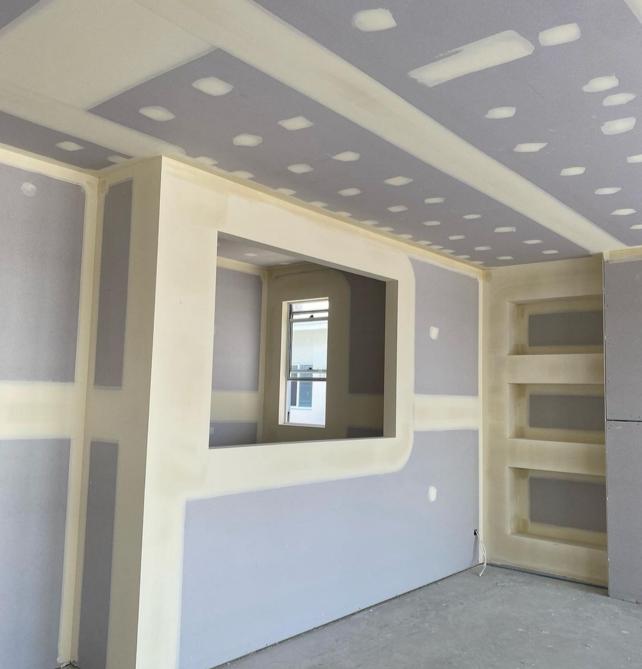 man holding incandescent bulb