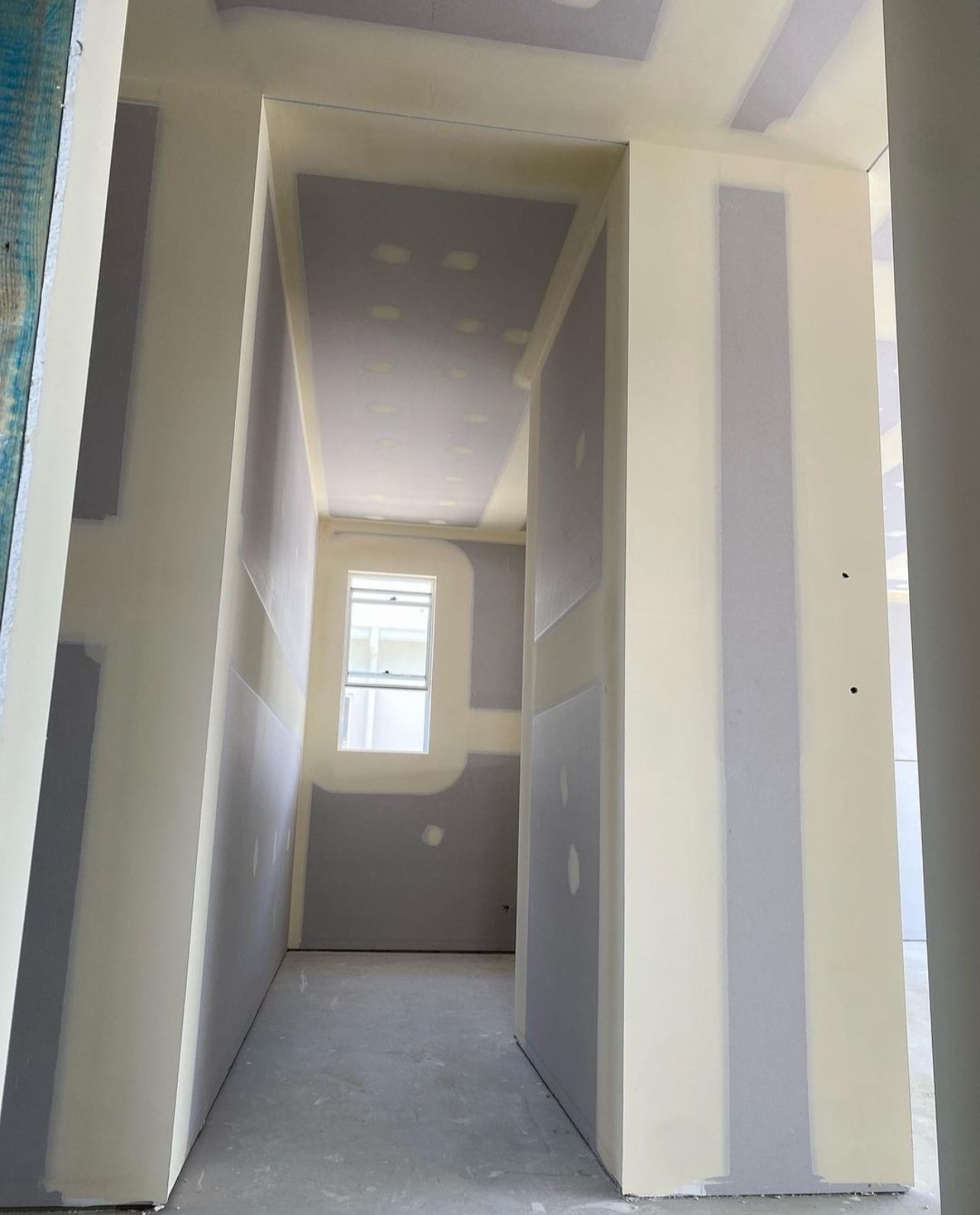 white robot near brown wall