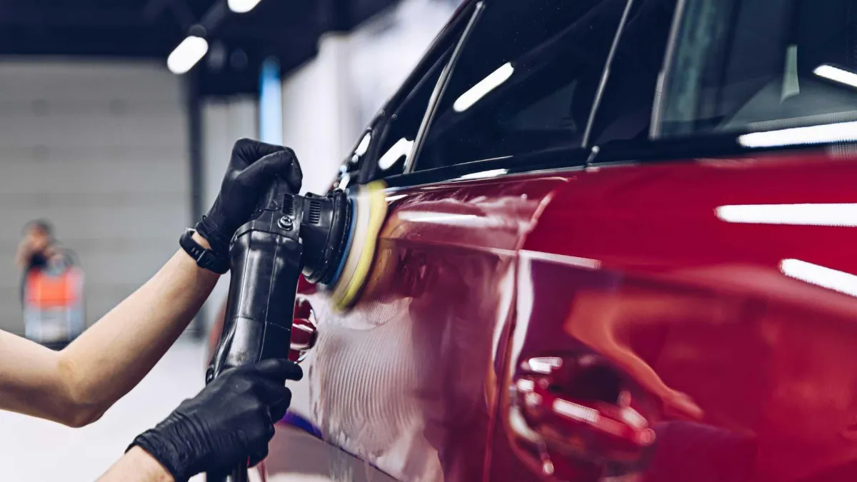 Car paint being polished to remove swirls and scratches