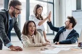 a business team is overjoyed at how there business has improved