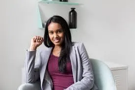 A business woman smiling and thinking to herself that was really easy