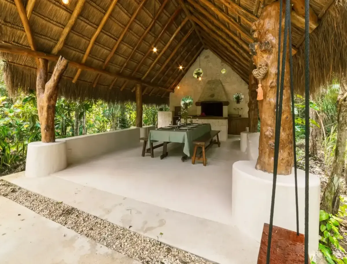Open-air palapa dining area set for meals at the sacred union retreat
