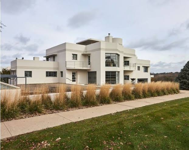 Warm-toned exterior view of the Italian American Cultural Center on Fleur Drive in Des Moines