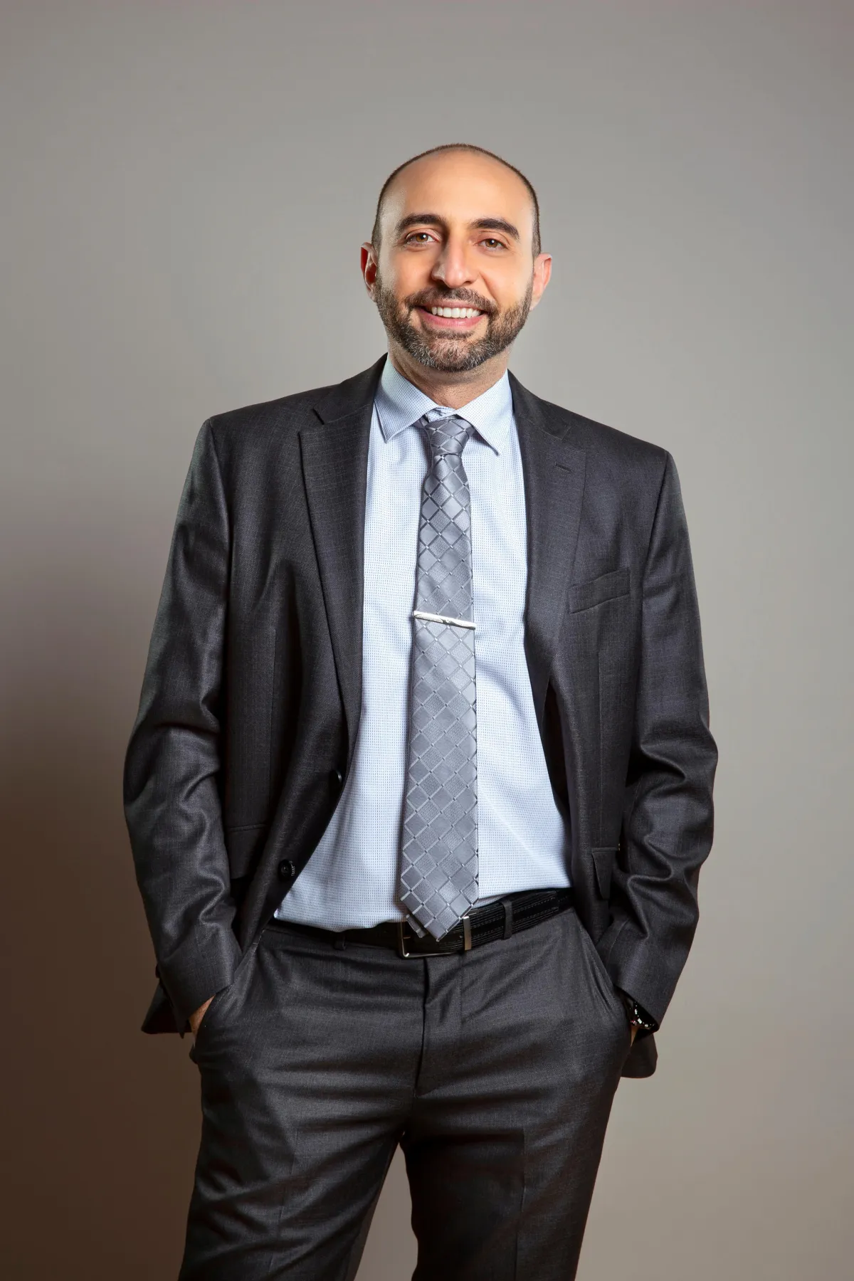 man wearing watch with black suit