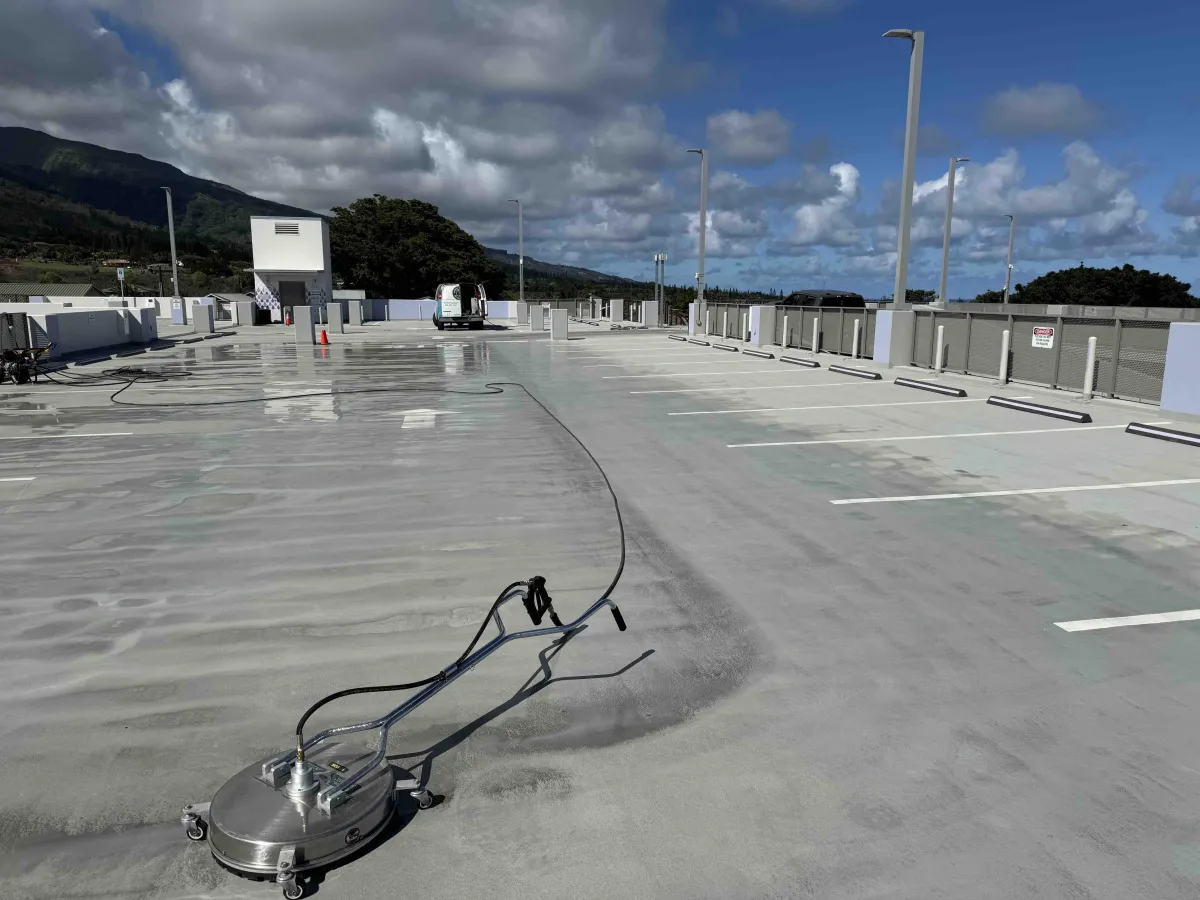 Pressure washing at massive parking garage in downtown wailuku