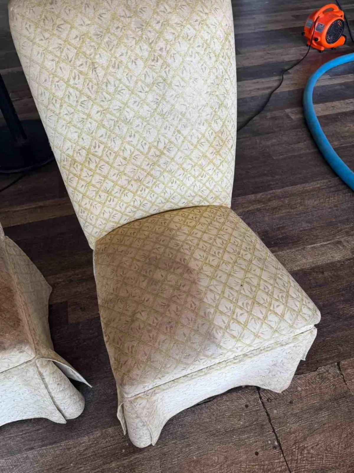 A cleaned chair with visible before and after results.